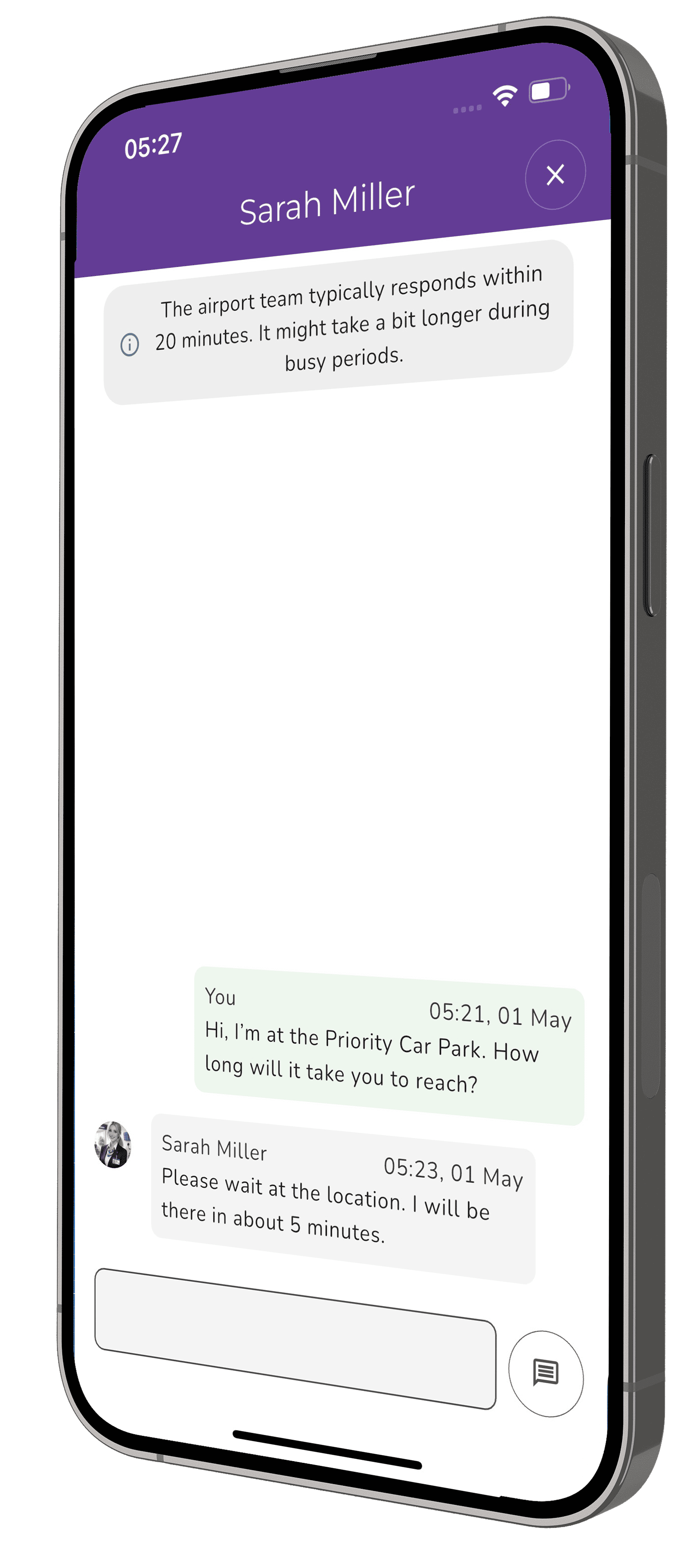 The screenshot on an iPhone shows the chat feature of Purple Door. Here the user, James, who has requested assisted travel is exchanging messages with Mary Lewis, who will be assisting him. James has reported at the Coach Station and has an extra bag. Mary will be meeting James in 5 mins and she says that an extra bag is perfectly fine.